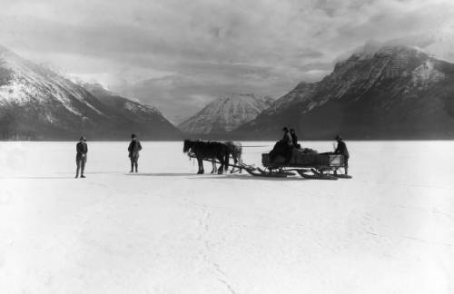 Hauling supplies across ice for Lake McDonald Hotel construction