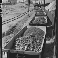 Butte, Montana. Anaconda Copper Mining Company. Train of copper ore cars leaving the mines in Butte for the smelter at Anaconda